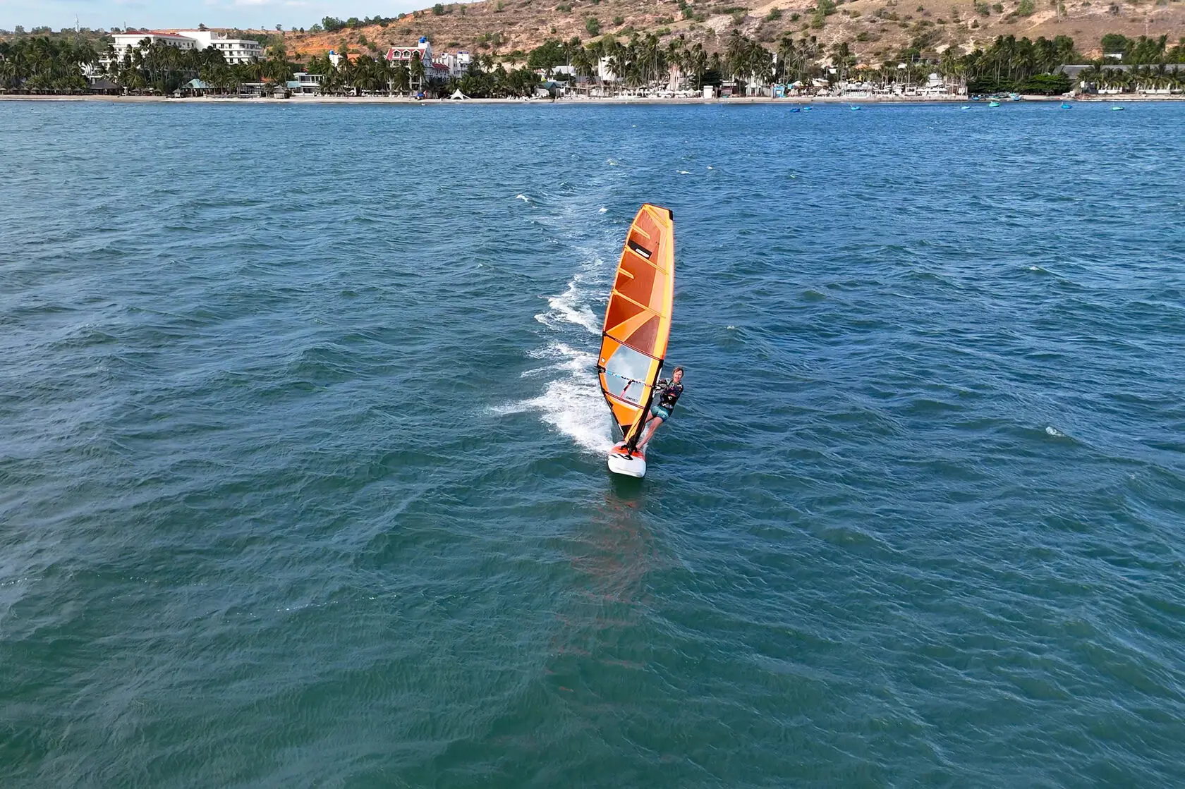 A windsurfer under sail