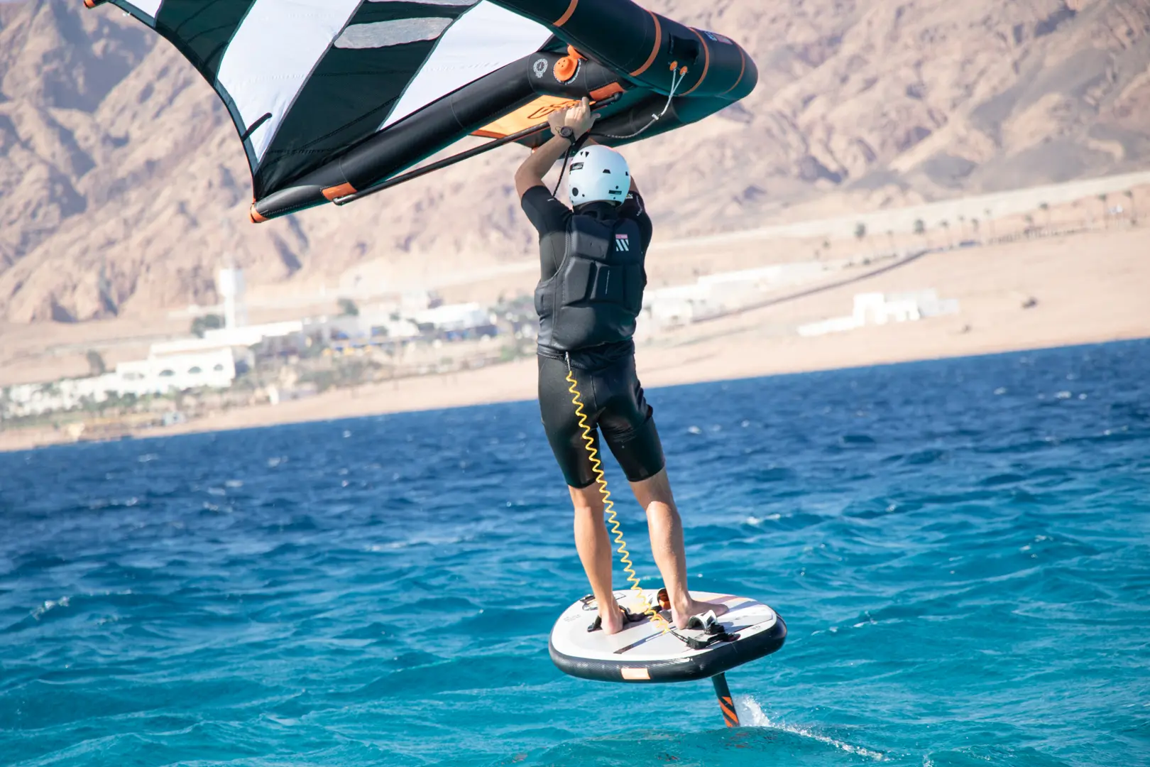 Practising turns and riding waves on a wingfoil