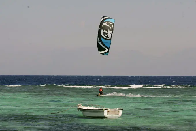 A kitesurfer on the water